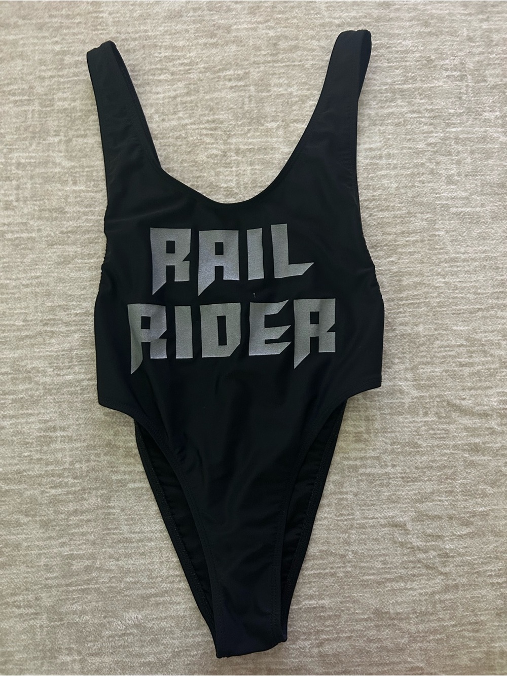 iHeartRaves Black Women’s One-Piece Swimsuit with Silver 'Rail Rider' Graphic